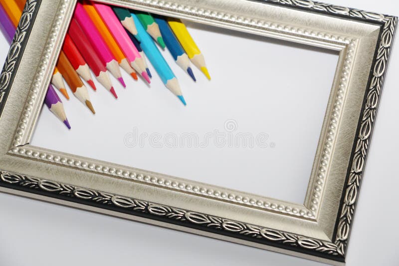 Vintage Frame for Paintings and Colored Pencils on a White Background