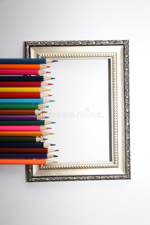 Vintage Frame for Paintings and Colored Pencils on a White Background