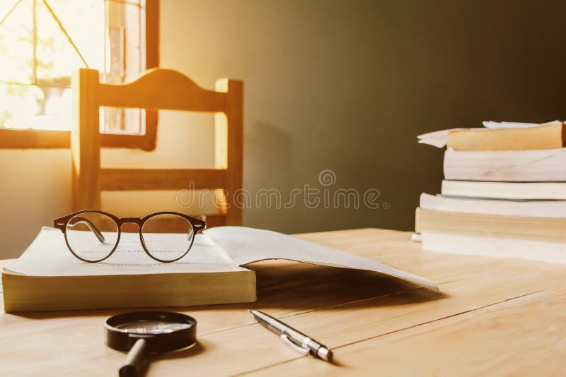 Vintage glasses,on books stack in public library book, Studying examining.