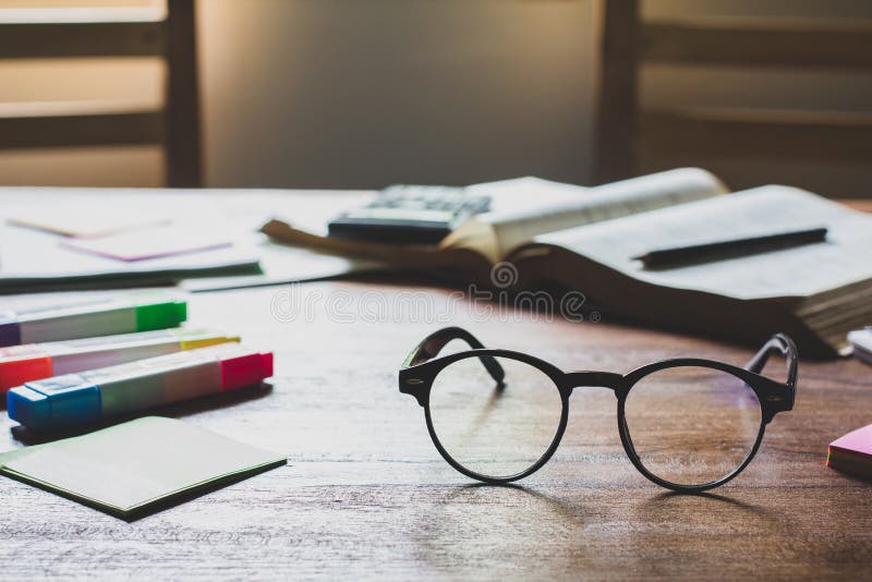 Vintage glasses on books stack in public library book, Studying examining learning People  learning education