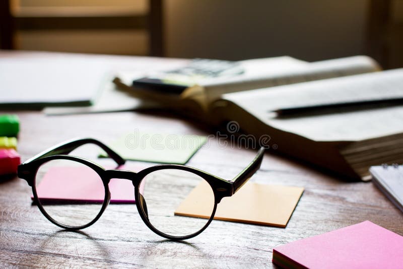 Vintage glasses on books stack in public library book, Studying examining learning People  learning education