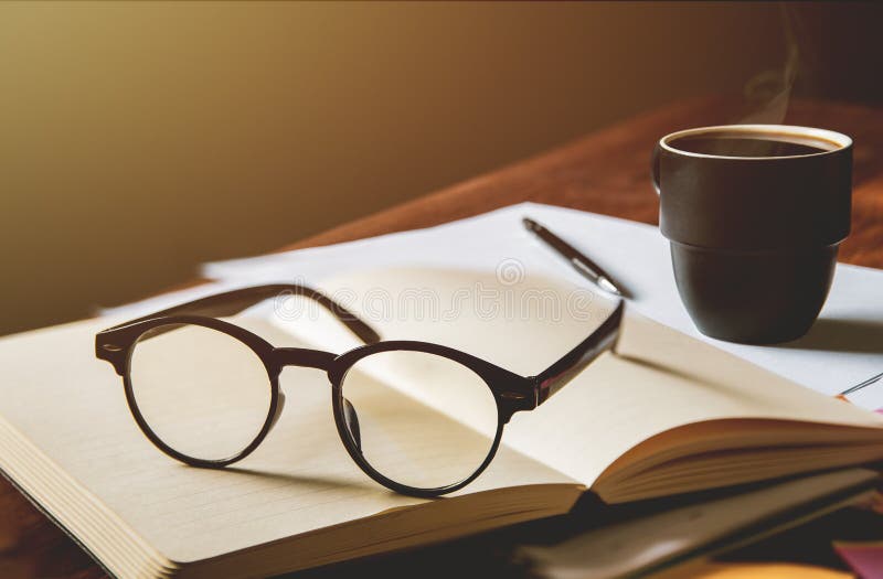 Vintage glasses,on books stack in public library book, Studying examining. Tutor books with friends. Young students campus helps f