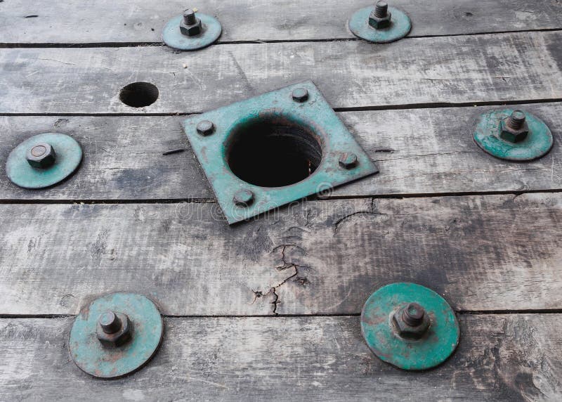 Vintage green bolt on vintage wood royalty free stock photo