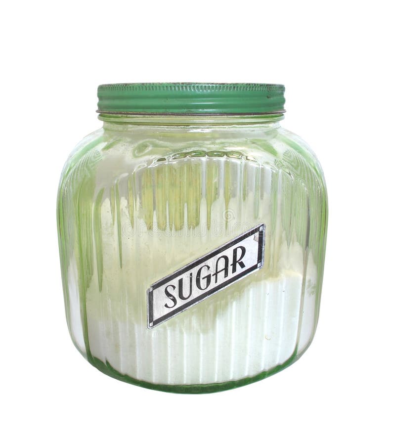 Vintage green glass jar with a metal lid for holding sugar, with a label that says “Sugar”. Isolated on white. Vintage green glass jar with a metal lid for holding sugar, with a label that says “Sugar”. Isolated on white.