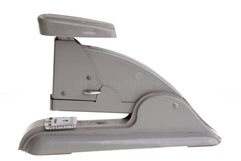 Vintage grey stapler, side view.