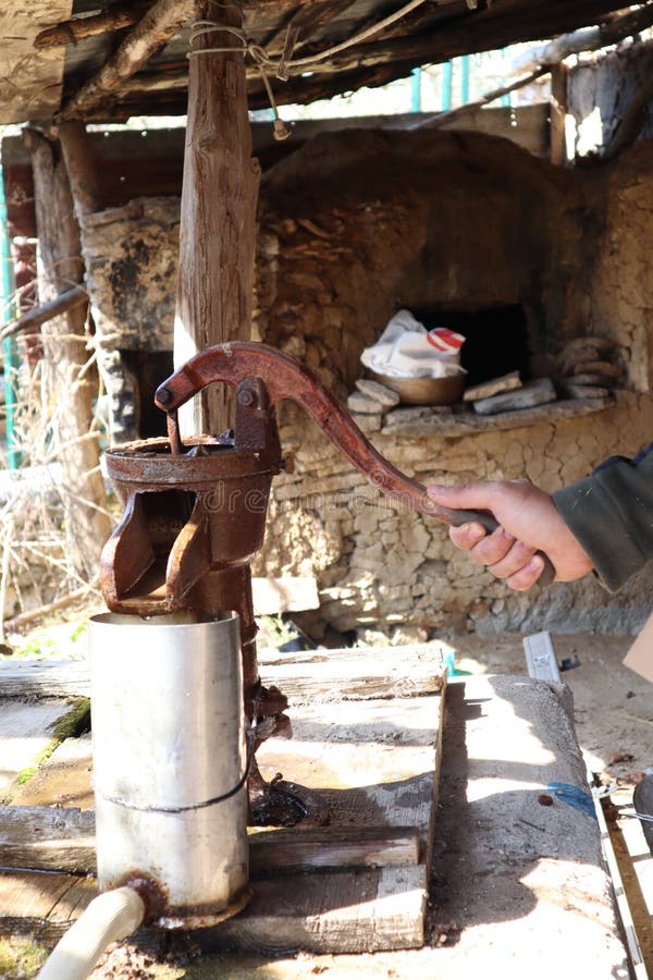 Old fashion hand water pump hi-res stock photography and images