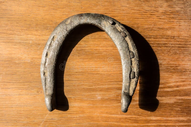 Antique Rusty Horseshoe Fixed On Nails On Old Wooden Surface Stock Photo,  Picture and Royalty Free Image. Image 79937196.