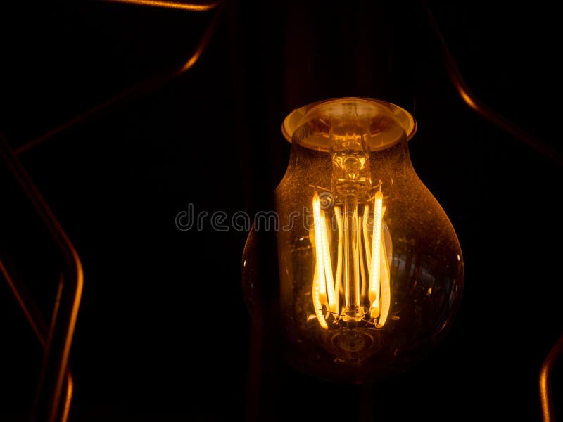 Vintage Incandescent Light Bulb Filament on Black, Close Up Shot Stock ...