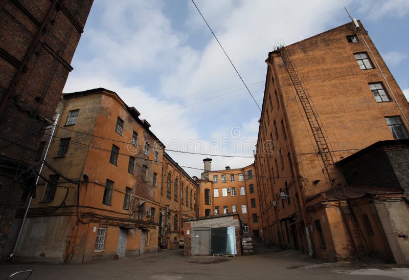 Vintage industrial red brick building in the industrial area of the old European city.