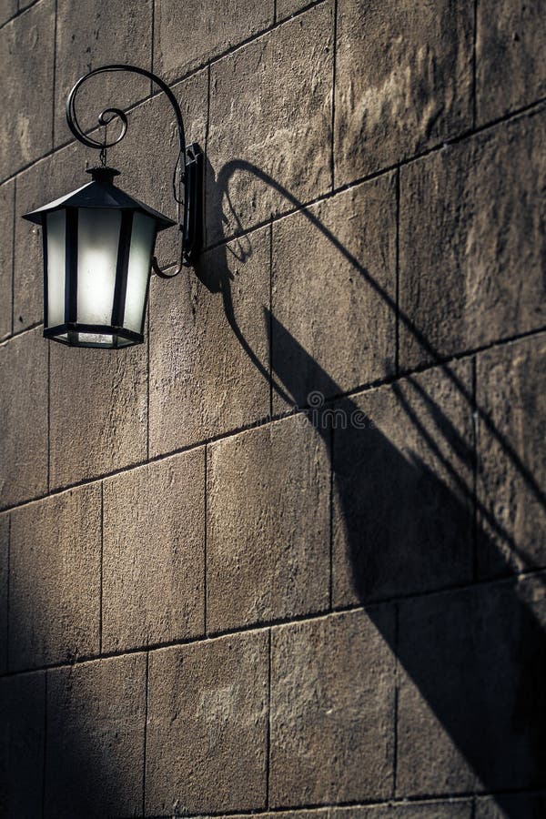 Vintage Lantern with Shadows on the wall royalty free stock photography