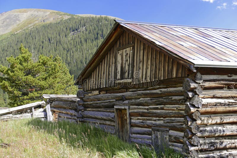 Vintage log cabin in old mining town in the mounta royalty free stock images