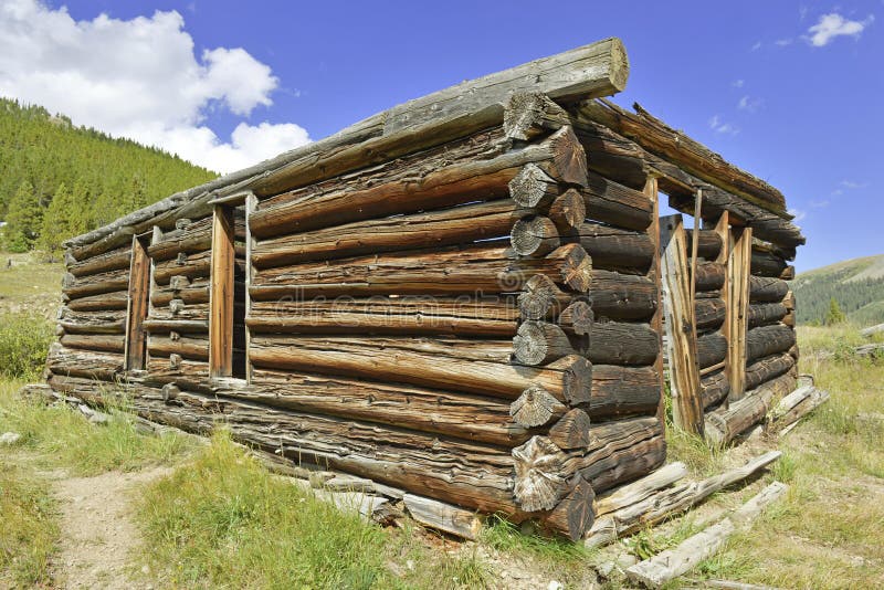 Vintage log cabin in old mining town in the mountains royalty free stock image