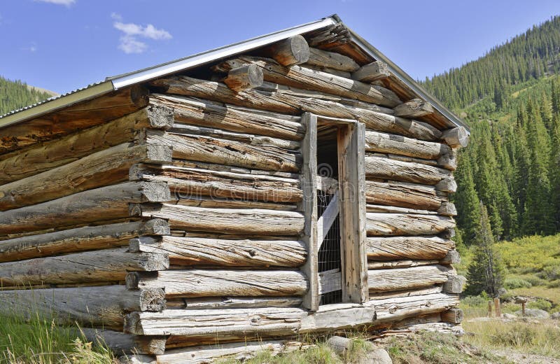 Vintage log cabin in old mining town in the mountains royalty free stock photos