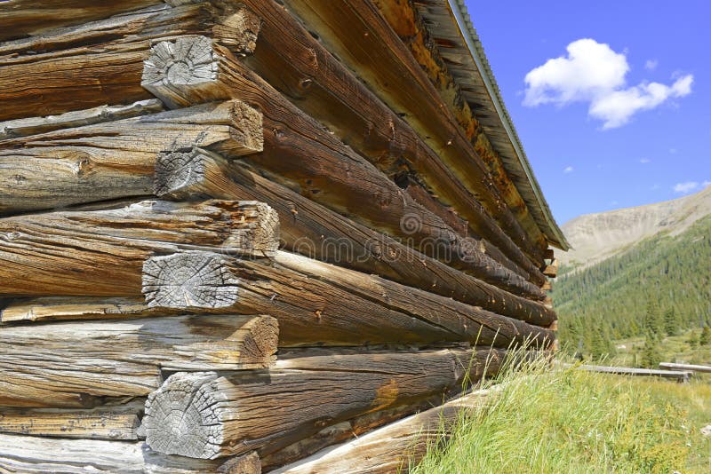 Vintage log cabin in old mining town in the mountains royalty free stock images