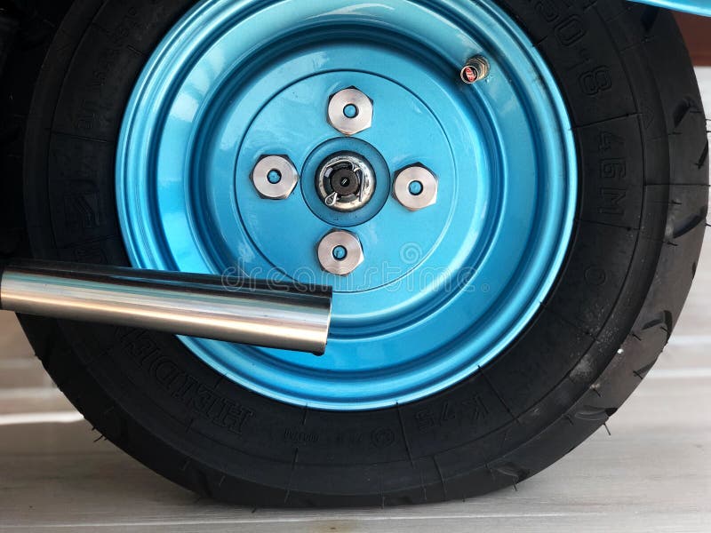 Vintage Metallic Blue Wheels, Scooter Wheels with Natural Light. Stock