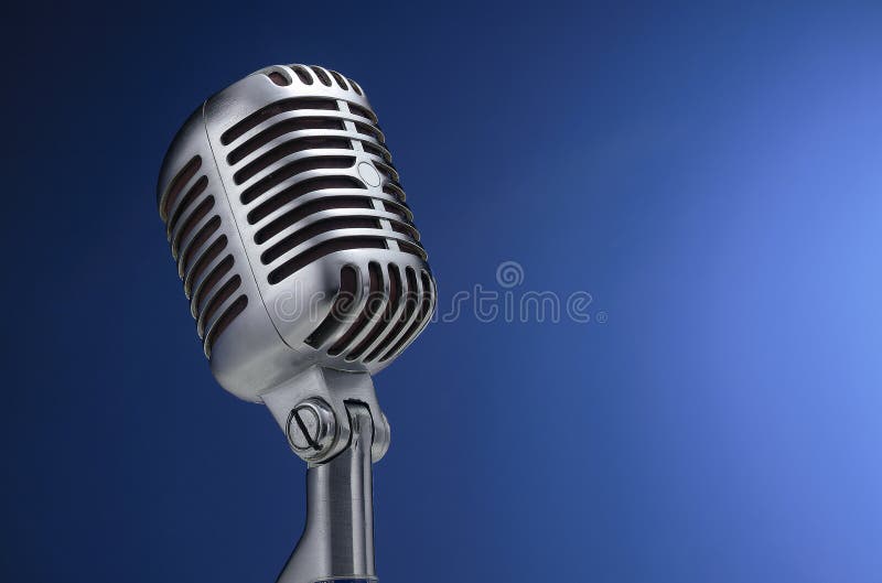 Vintage microphone on blue