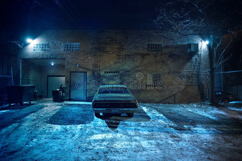 Vintage muscle car in a dark Chicago city urban alley.