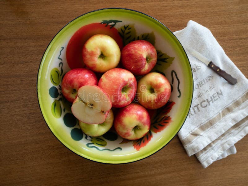 Vintage Painted Tin Bowl with Apples with Dish Towel and Paring stock photo Vintage Painted Tin Bowl with Apples with Dish Towel and Paring stock photo