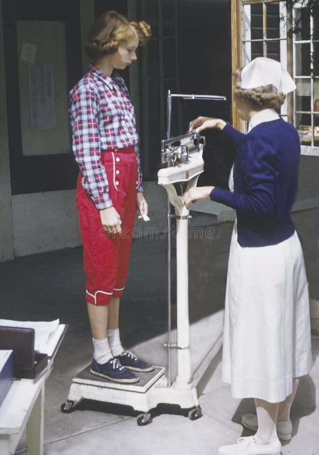 Vintage photo girl weighed