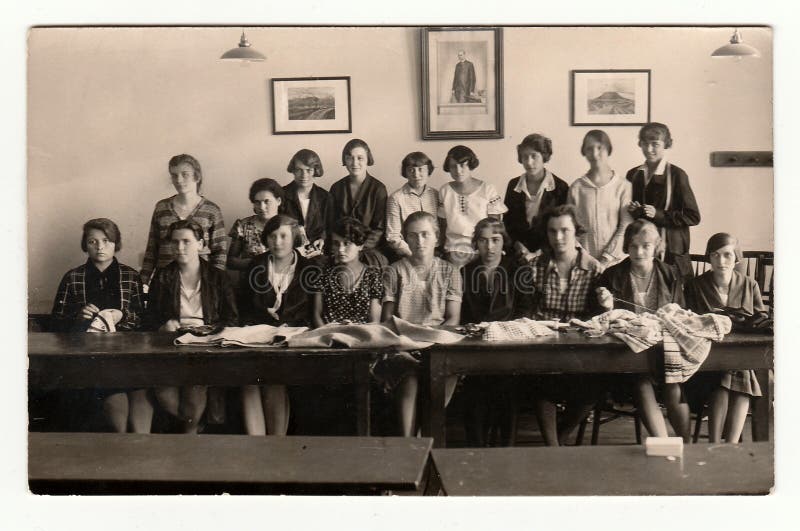 Vintage photo of a group girls in the classroom, 1933