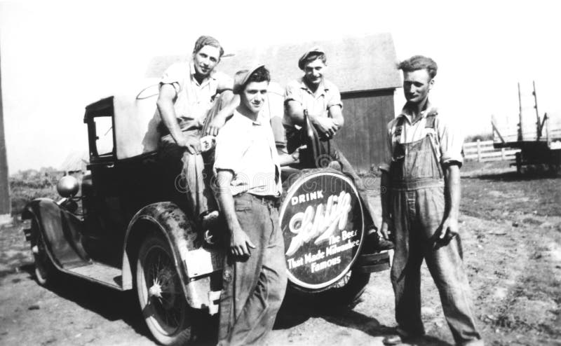 Vintage Photo Young Men on Farm and Model T stock images Vintage Photo Young Men on Farm and Model T stock images