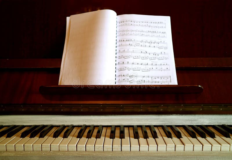 Vintage Piano with a Music Book Stock Photo - Image of light, indoor