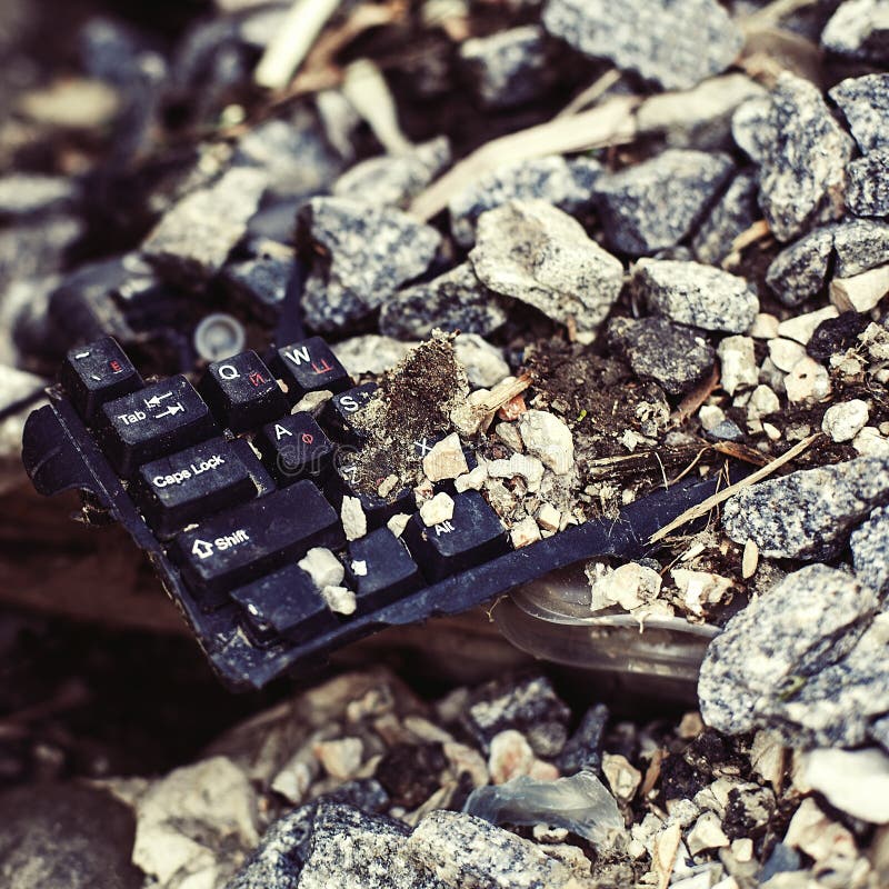 Vintage picture about broken keyboard on the garbage