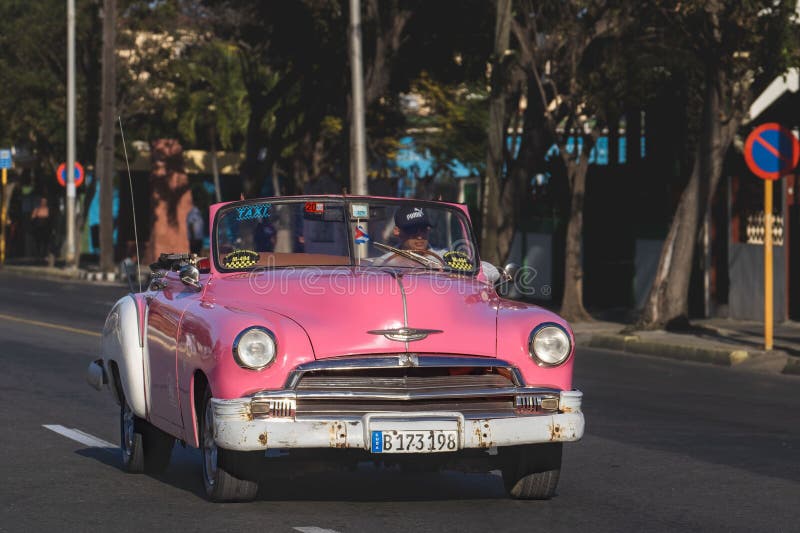 Vintage Pink Car on a Street in a Quaint City at Daytime Editorial ...