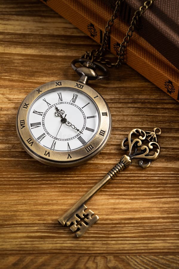 Vintage Pocket Watch Clock with Key and Book on Wooden Background Stock  Image - Image of reading, hard: 152383835