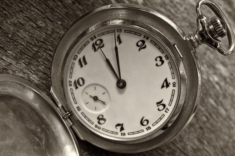 Vintage pocket watch on weathered wood background. royalty free stock image Vintage pocket watch on weathered wood background. royalty free stock image
