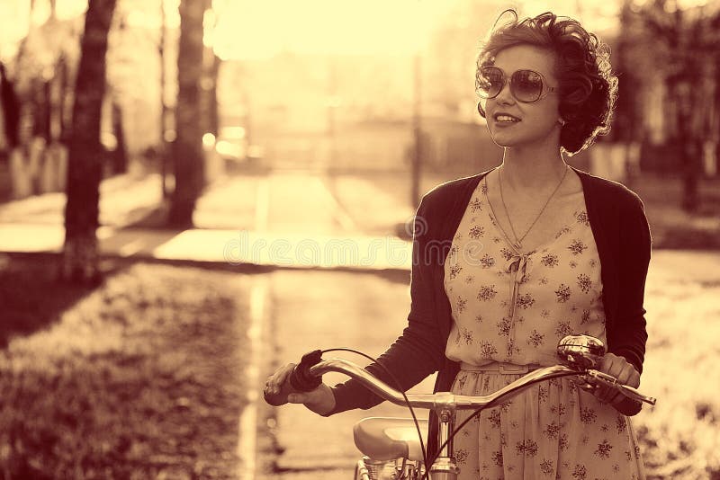 Vintage portrait of a girl with bike royalty free stock photos Vintage portrait of a girl with bike royalty free stock photos