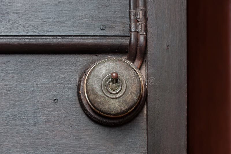 A Vintage put light switch on wooden interior wall