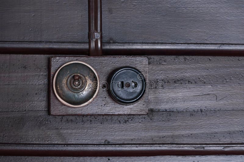 A Vintage put light switch on wooden interior wall