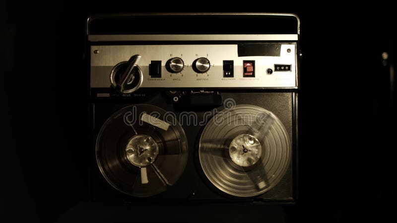 Vintage Reel to Reel Player Operating in Dark Room stock footage