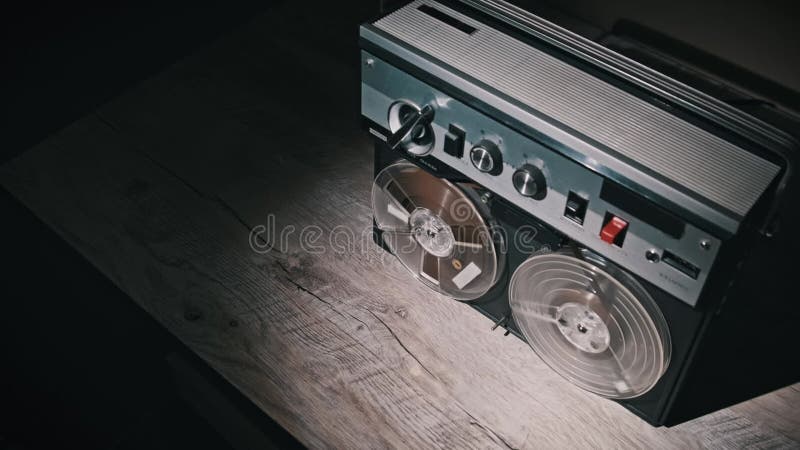Vintage reel-to-reel recorder rotating tapes stock footage