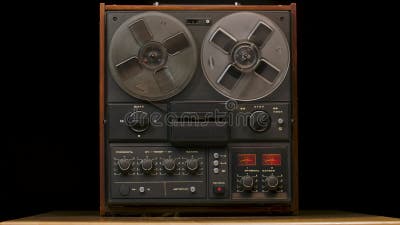 Vintage Reel To Reel Tape Recorder Playing Against a Black Studio  Background. Retro Music Player Plays Old Music Stock Footage - Video of  listen, party: 206753224