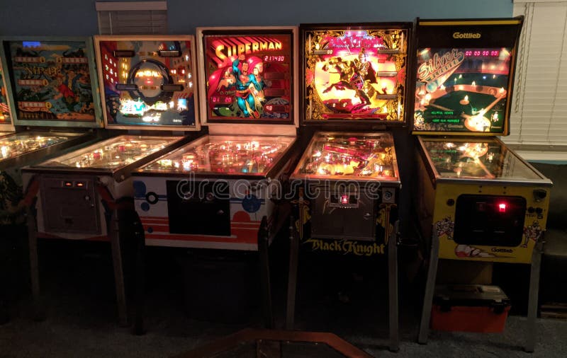 Vintage 70s-90s Pinball Machines in Arcade Editorial Photography