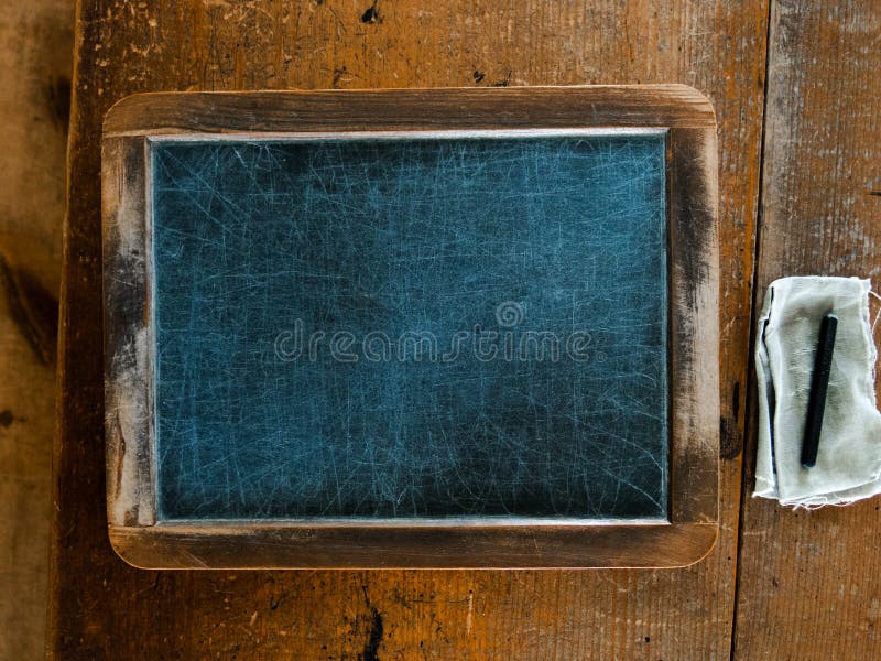 School Written on Vintage Chalkboard and a Chalk on the Board