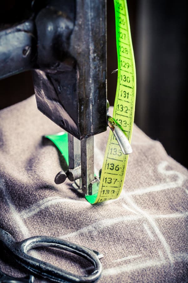 pattern, scissors, tape measure, and a sewing machine. Workplace