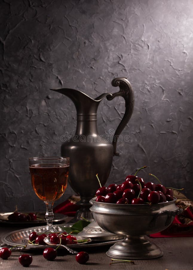 Vintage still life with ripe cherry and pewter