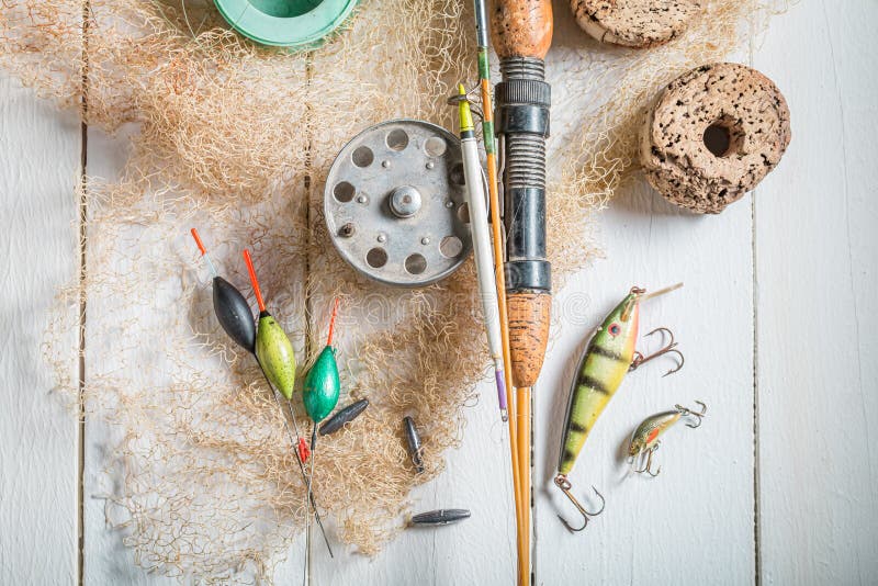 Vintage stuff for angler with rod and lures. Fishing preparation