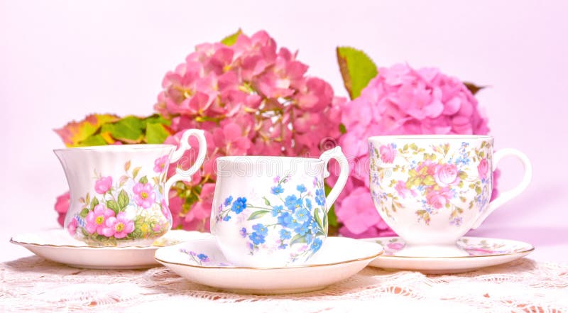 Attractive fine bone china tea cups on a pink background