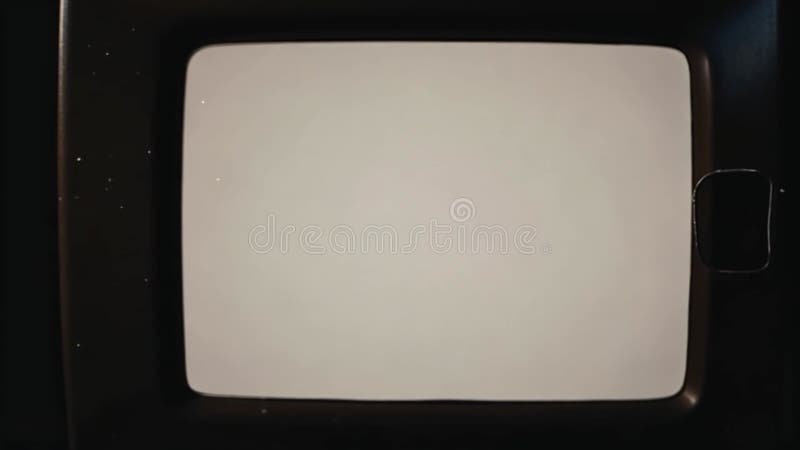 Close-up of a vintage television screen showing a blank white display. A nostalgic image of retro technology. Nostalgic image video