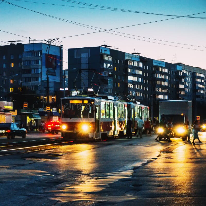 Vintage tram in Samara city downtown with another street cars or traffic in summer evening stock photo Vintage tram in Samara city downtown with another street cars or traffic in summer evening stock photo