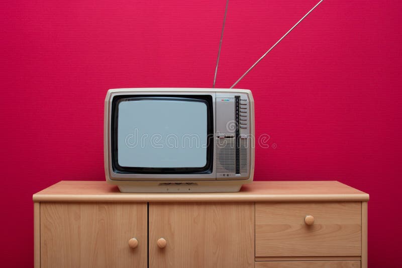 Vintage tv set on a cabinet in a room