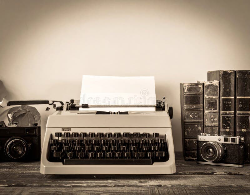 Vintage Typewriter and Camera with Stack of Aged Books on a Wooden Table stock illustration