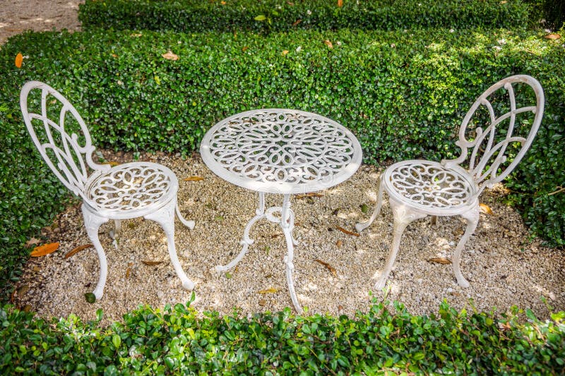 Vintage White Metal Table and Chairs in Garden Stock Image - Image of ...