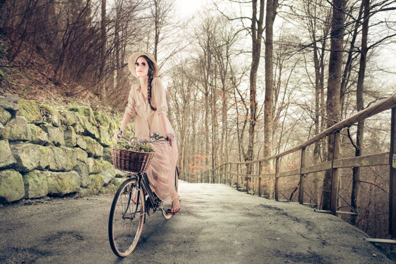 Vintage woman riding the bike