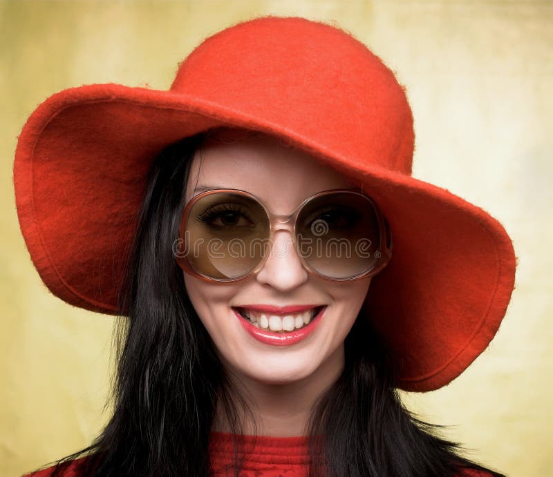 Vintage woman in sunglasses and red hat