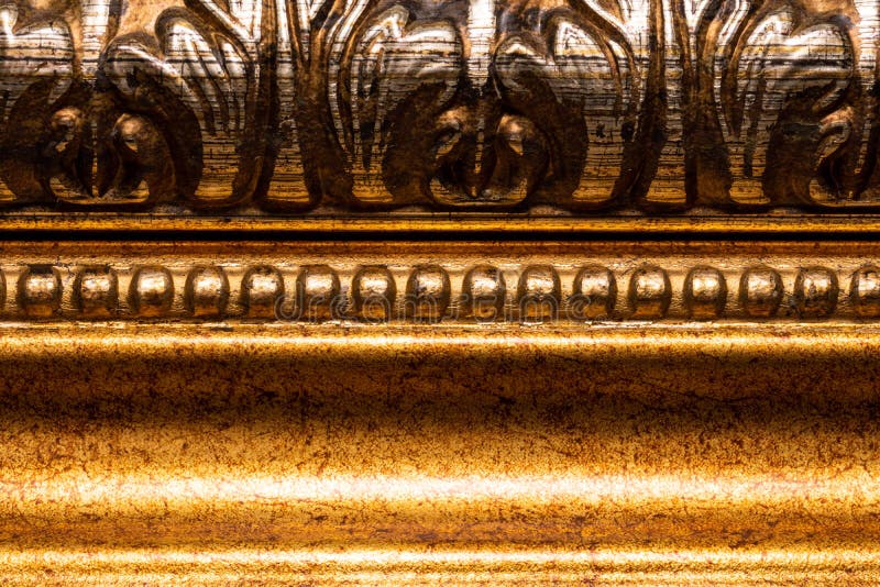 Vintage Wooden Frame in Gold Paint Curved with Patterns Stock Photo